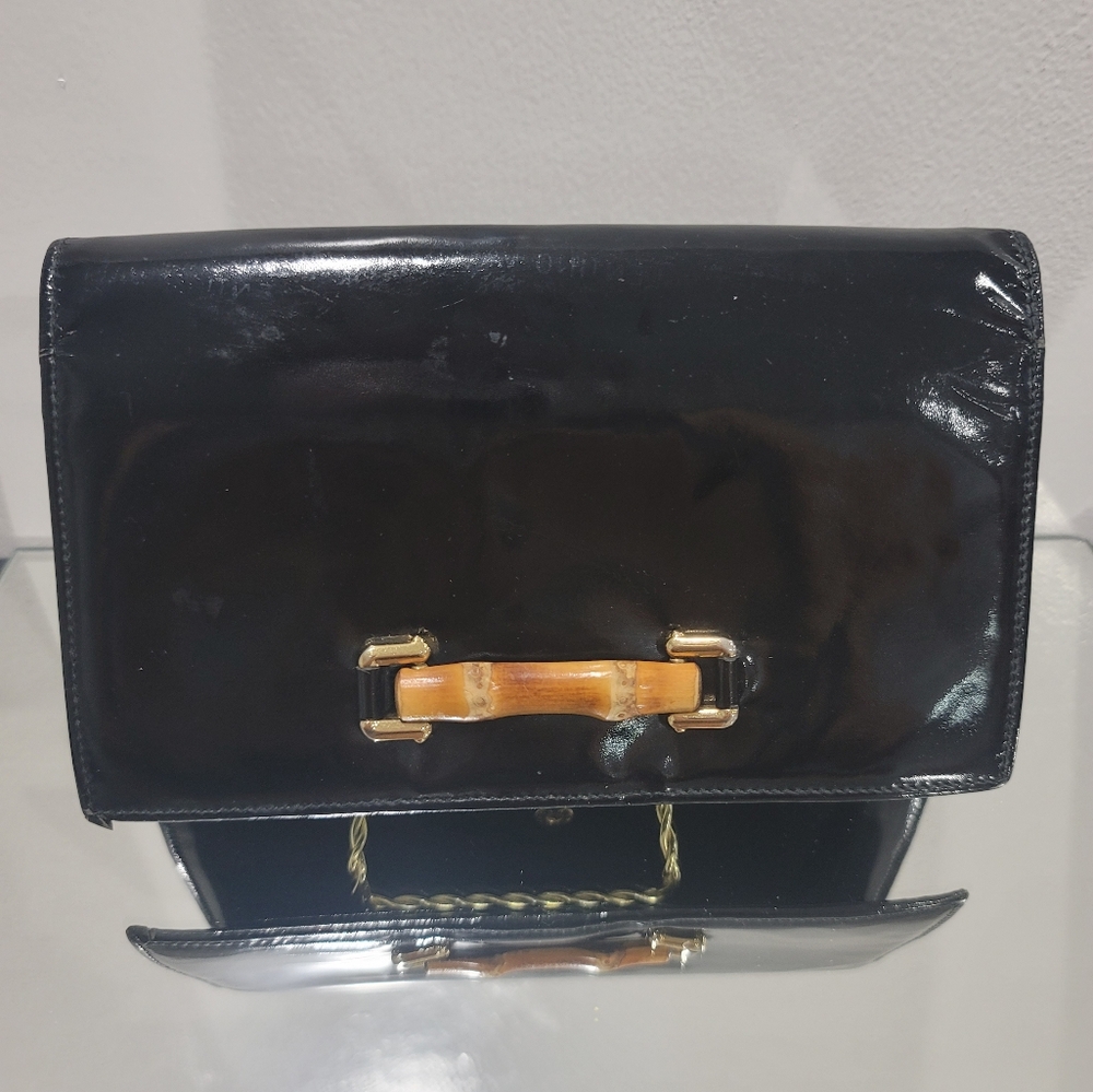Gucci Black Leather Clutch with Gold Accents
